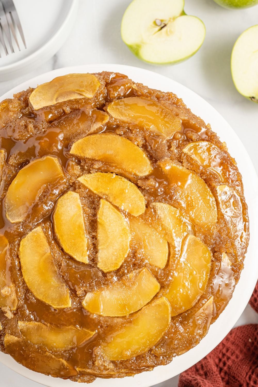 Apple Upside Down Cake on a platter on table