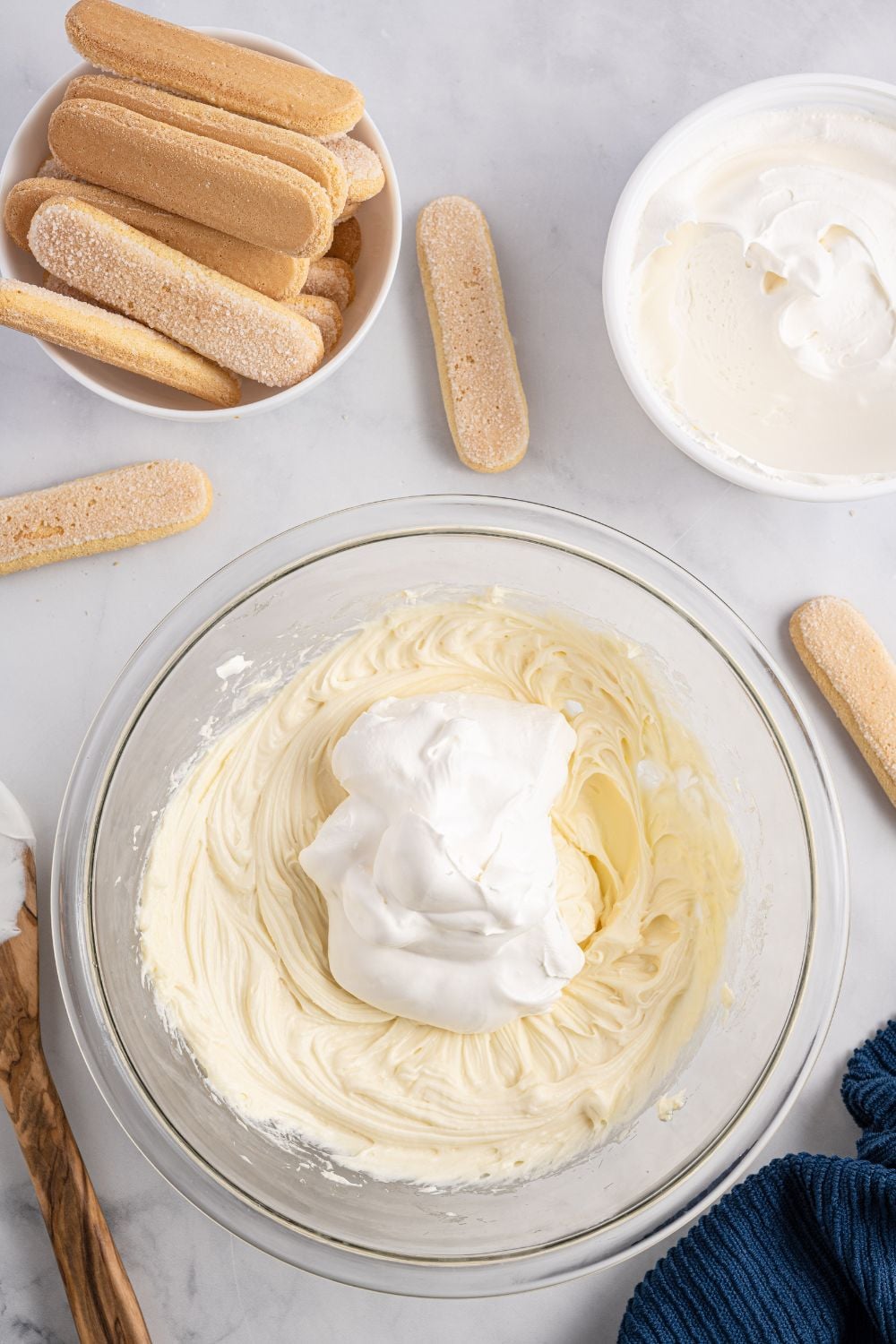 ingredients for the base of tiramisu in a glass bowl