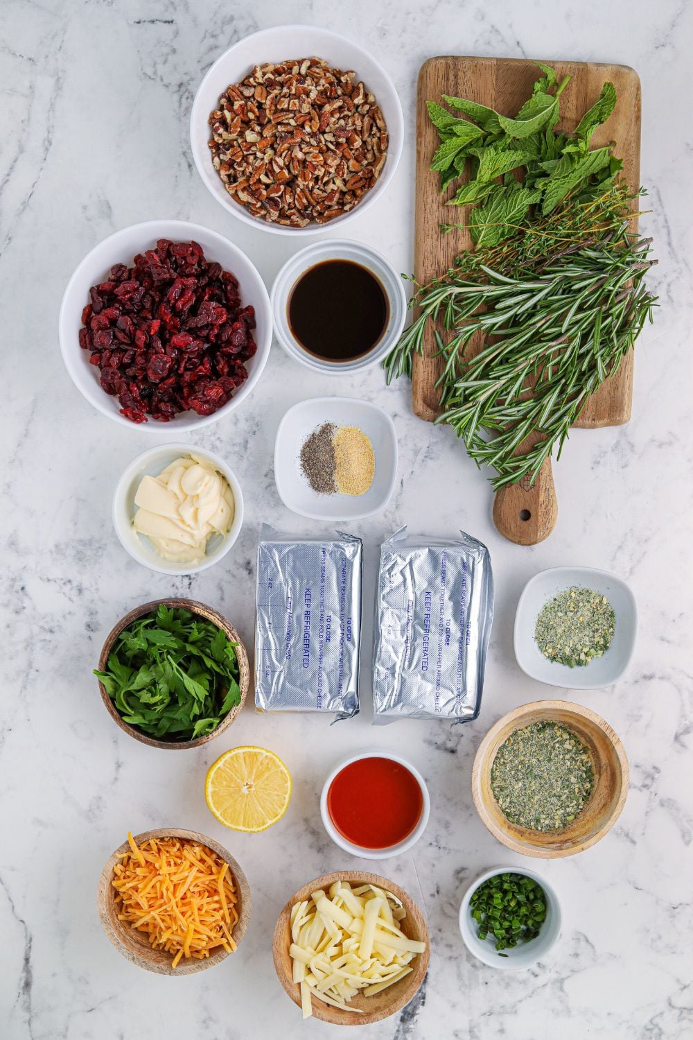 wreath cheese ball ingredients on a marble counter