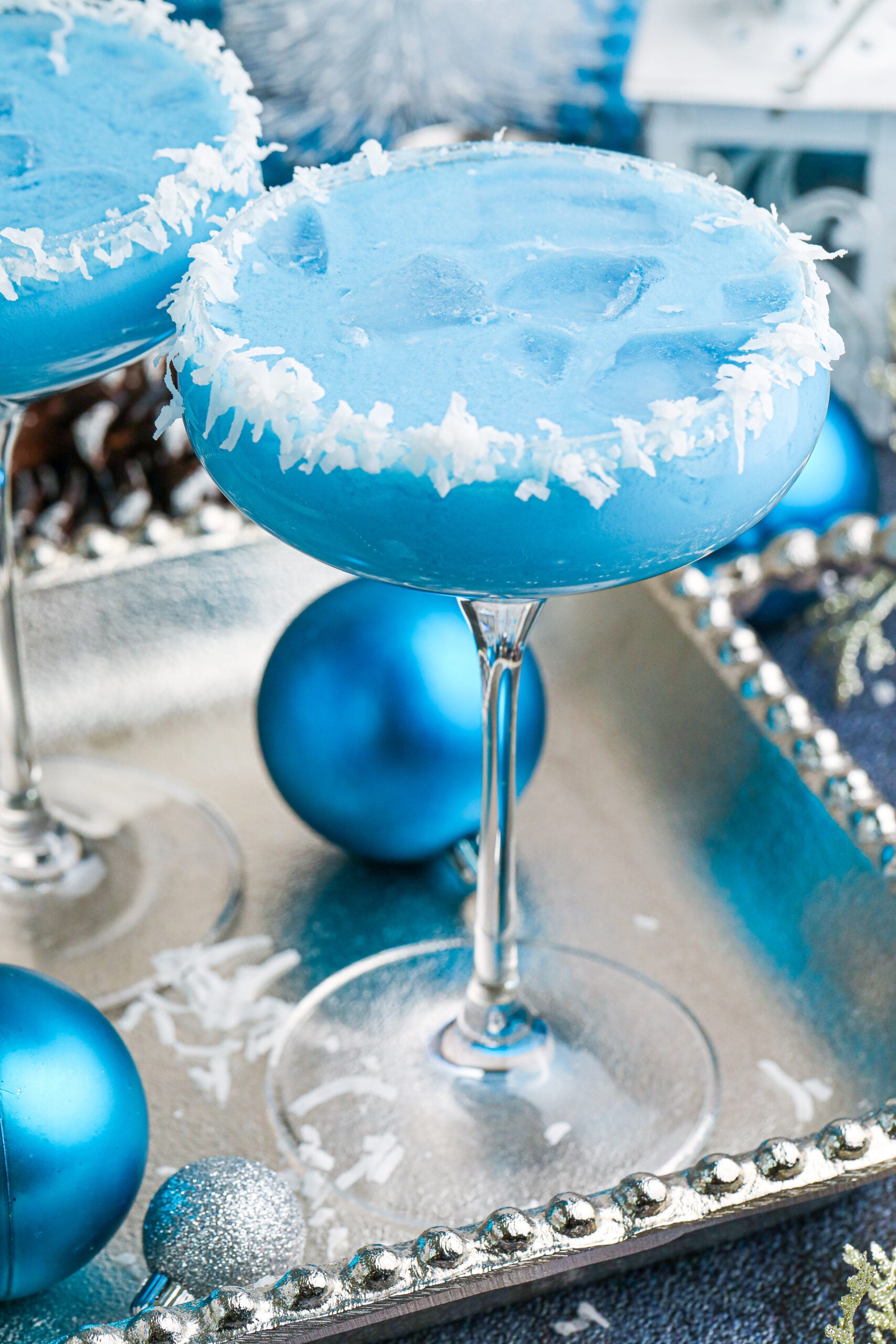 blue Christmas cocktail with a coconut rim