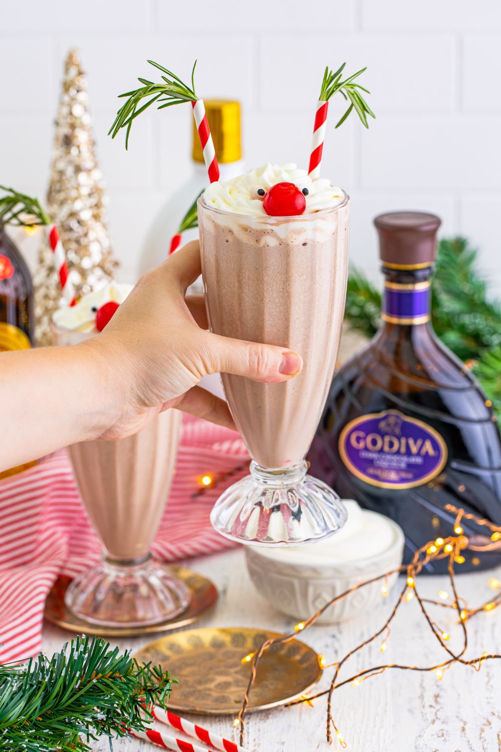 Rudolph Cocktail being held in a hand