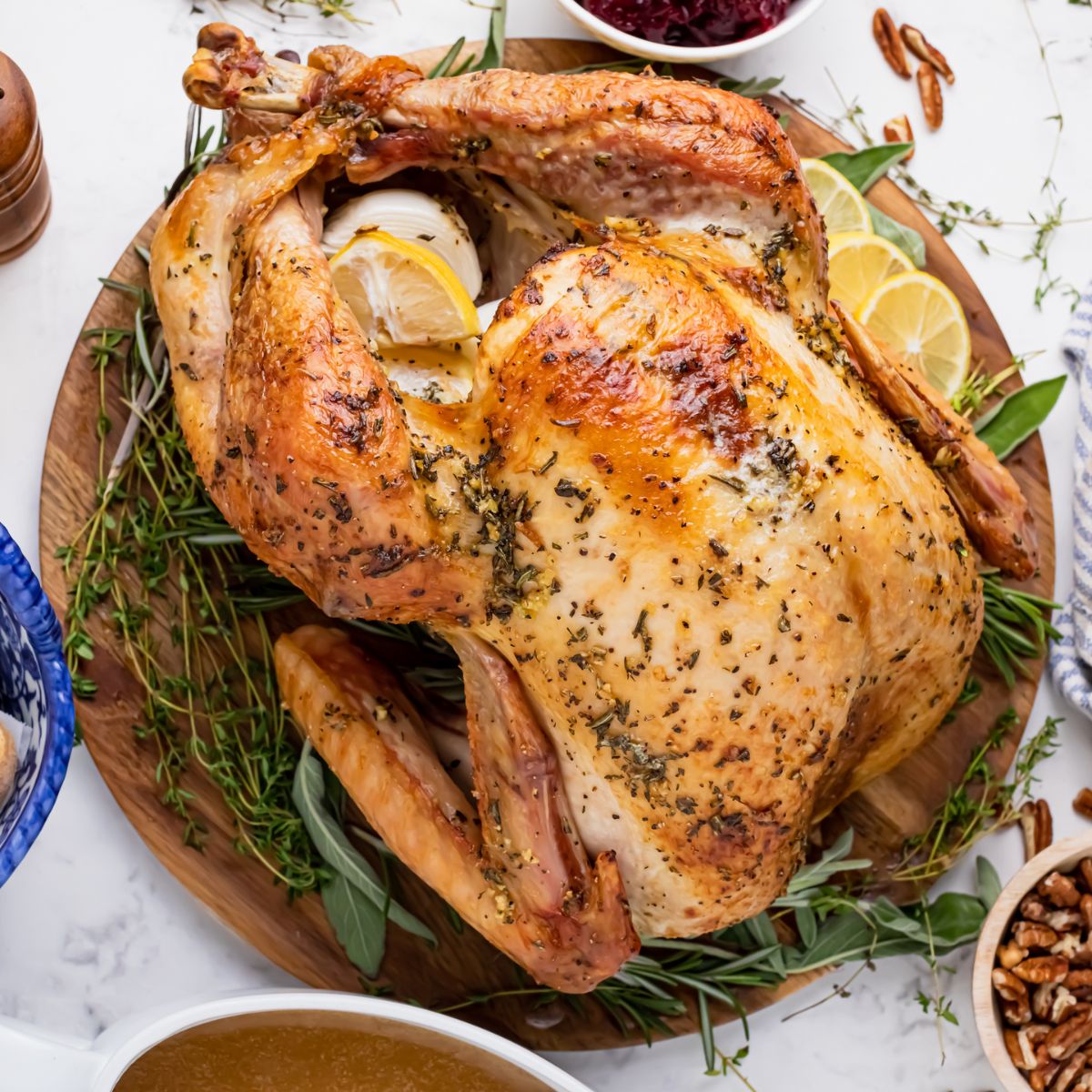 whole roasted turkey on a platter on table