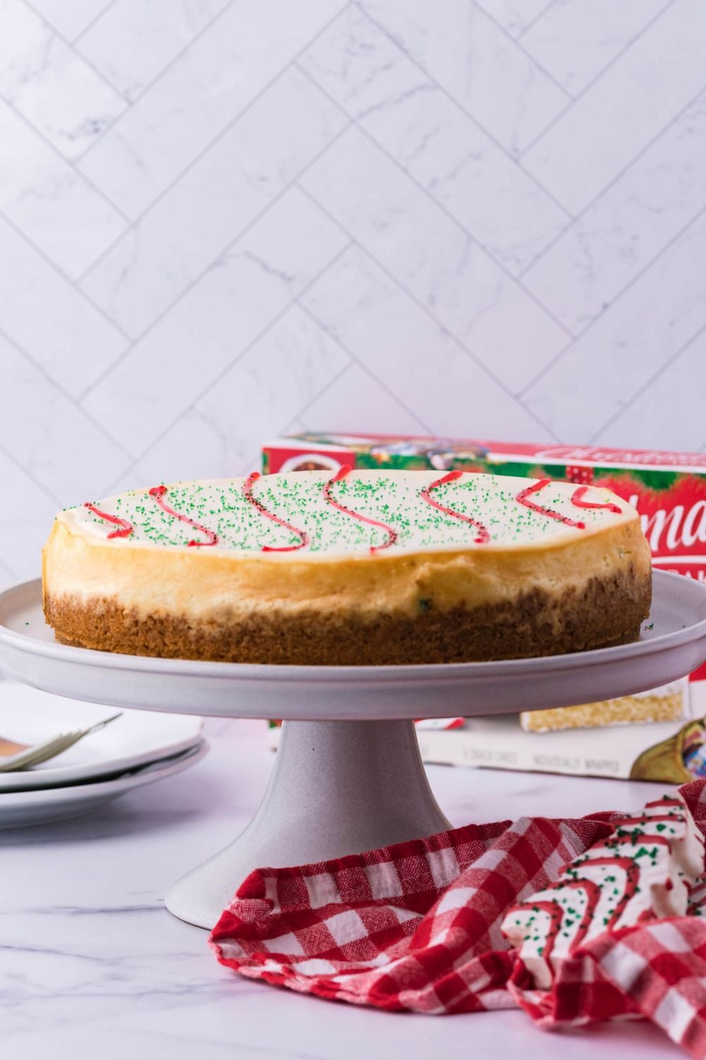 cheesecake on a cake stand on table 
