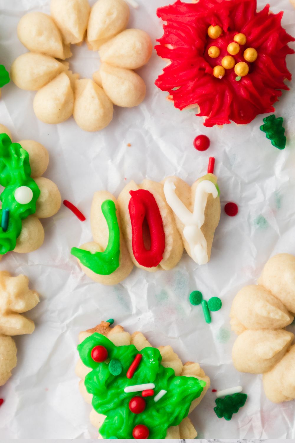 joy worded cookie on table with more cookies around it