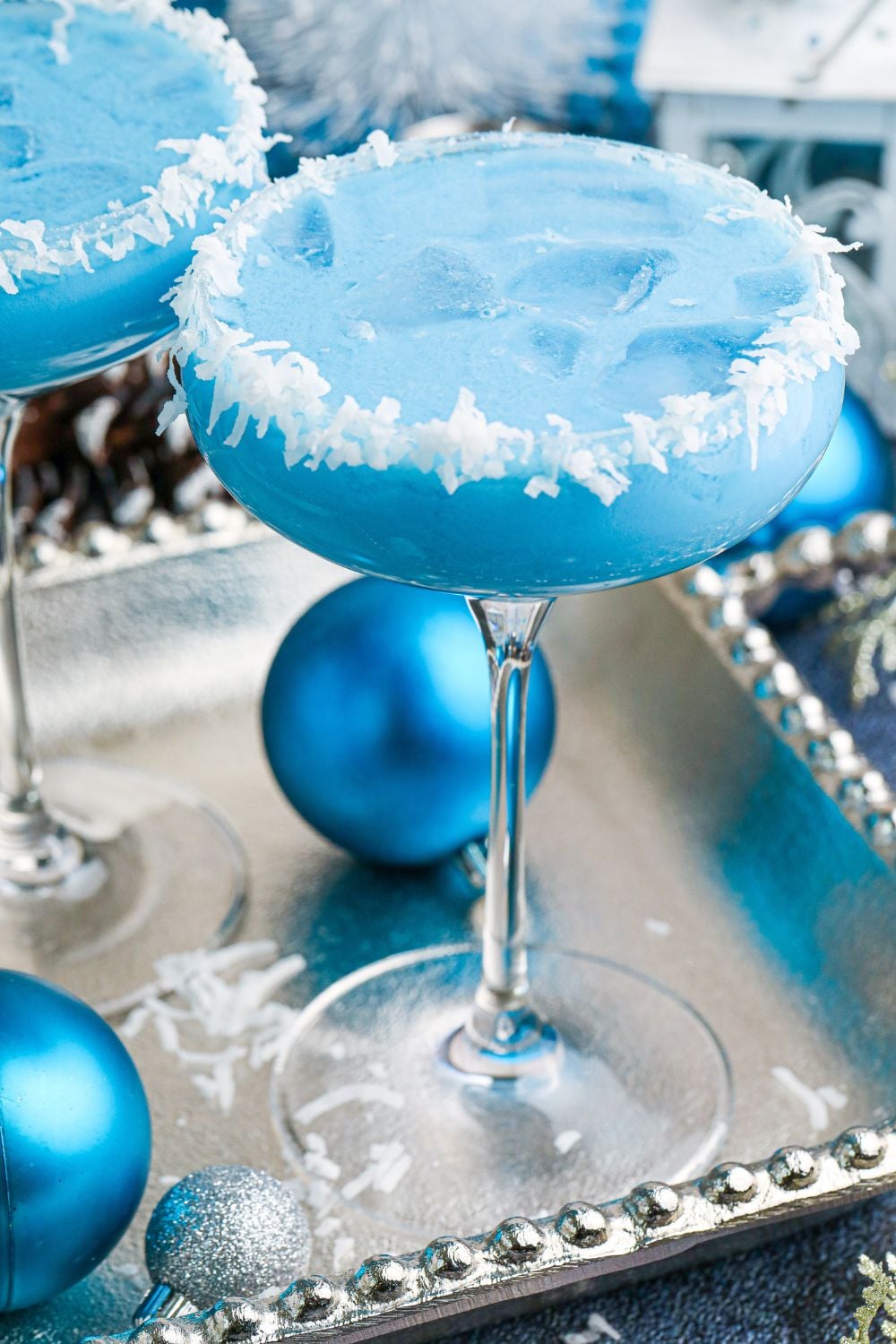 cocktail with christmas ornaments around the plater 