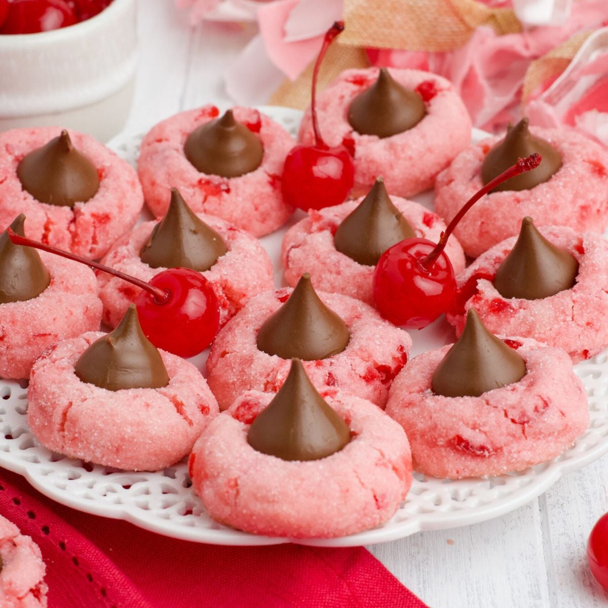 cherry cookies on platter with fresh cherries around it