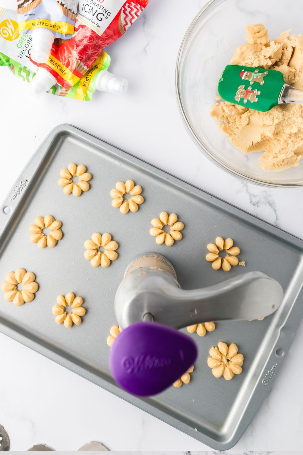 spritz cookies on baking sheet