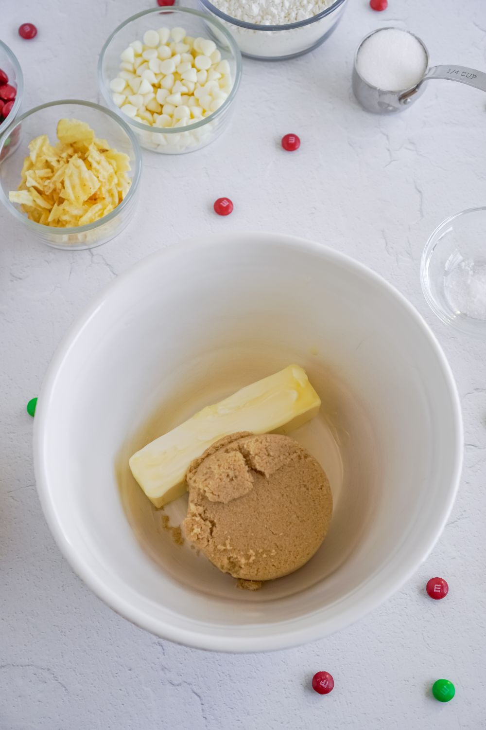 butter and brown sugar in a white mixing bowl