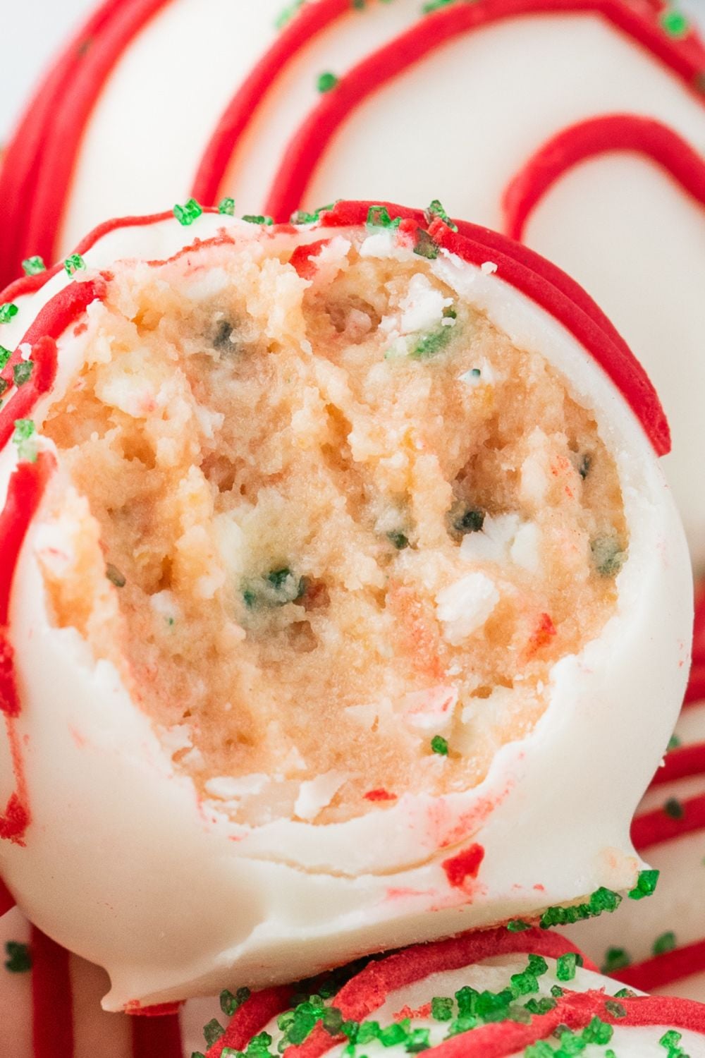 Little Debbie Christmas Tree Cake Truffles in a bowl with a bite taken out of one