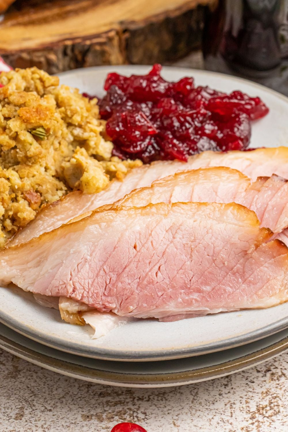 coca cola glazed ham and sides on a white plate on table