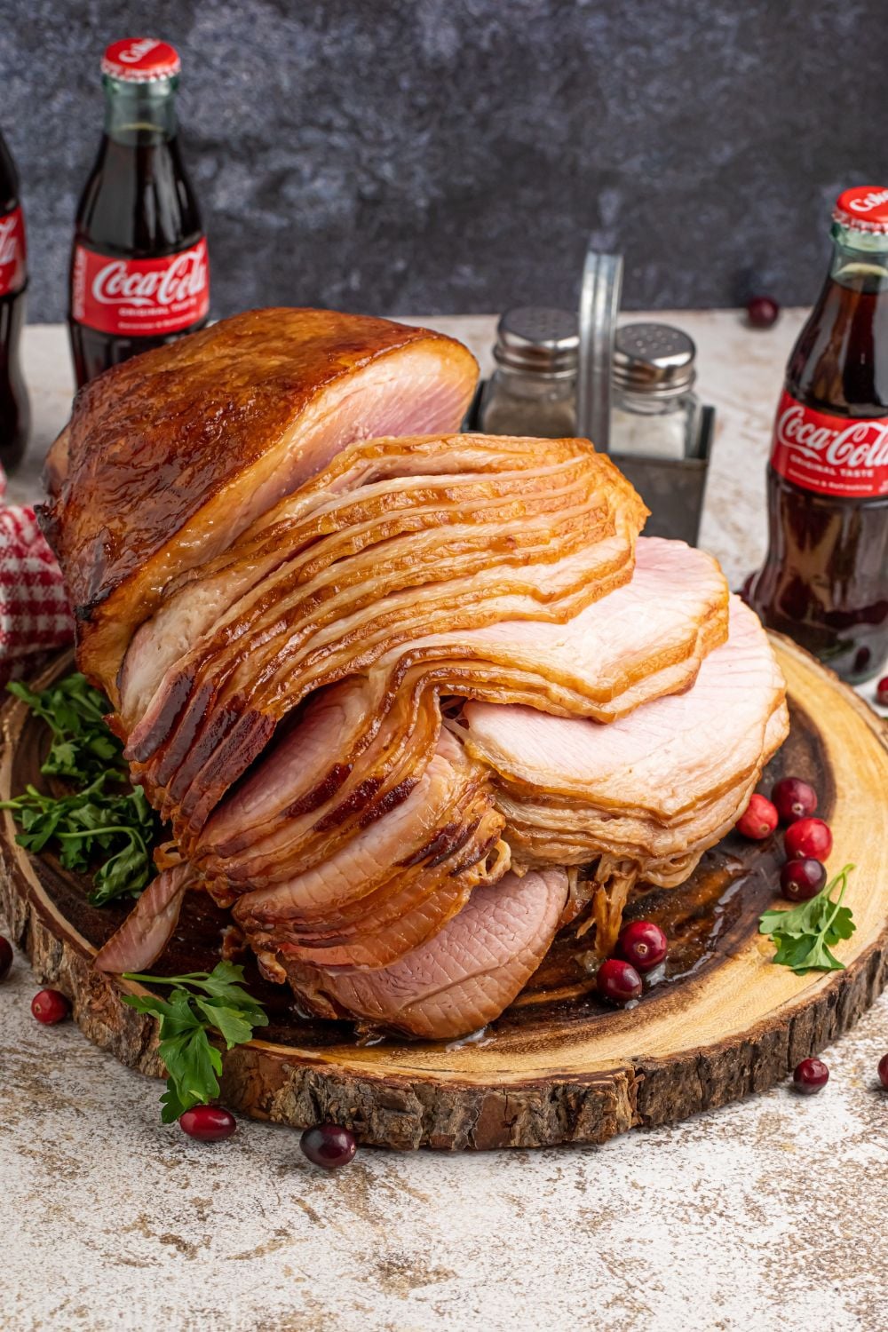 holiday ham on table with bottles of coca cola