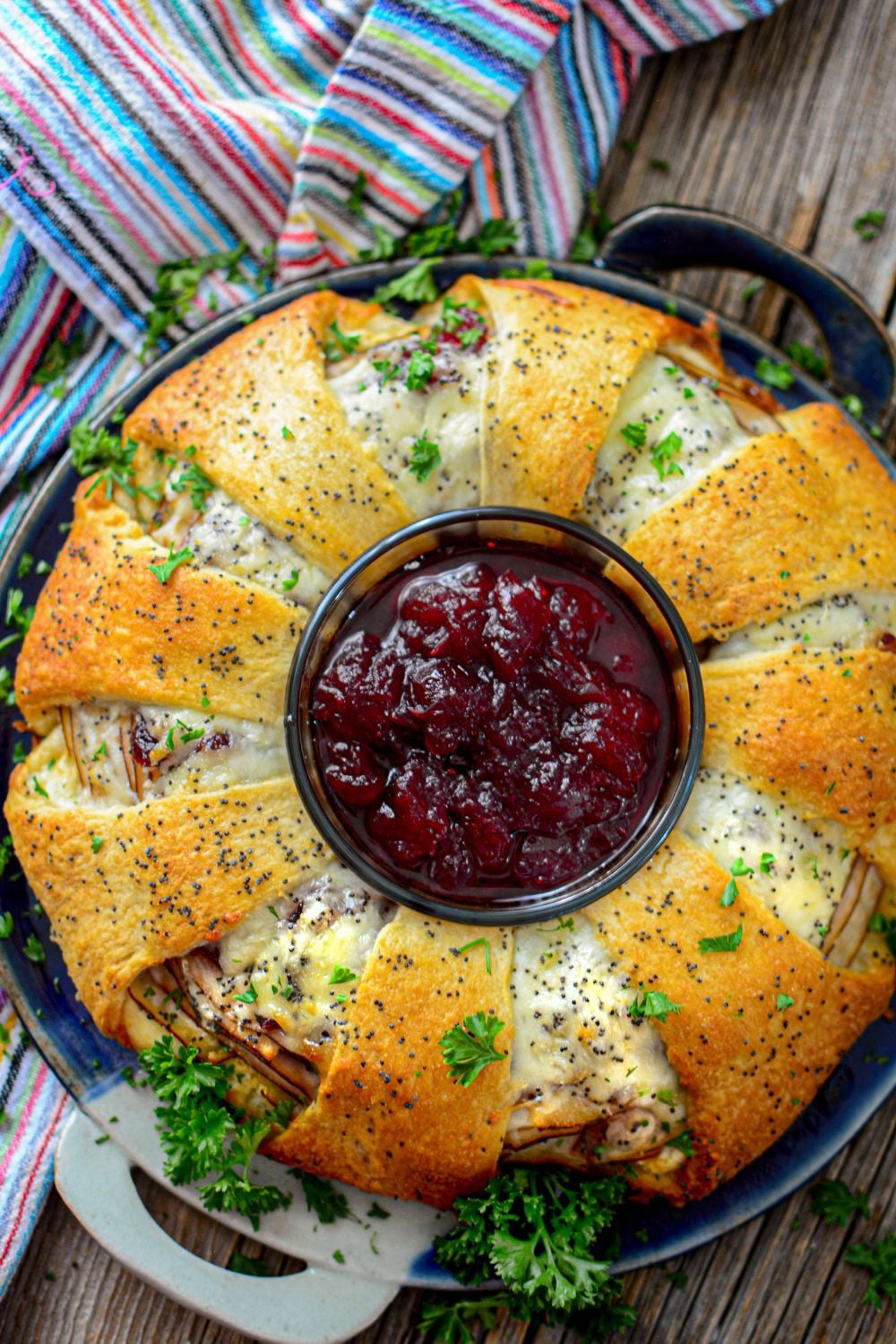 cranberry and turkey crescent wreath on table