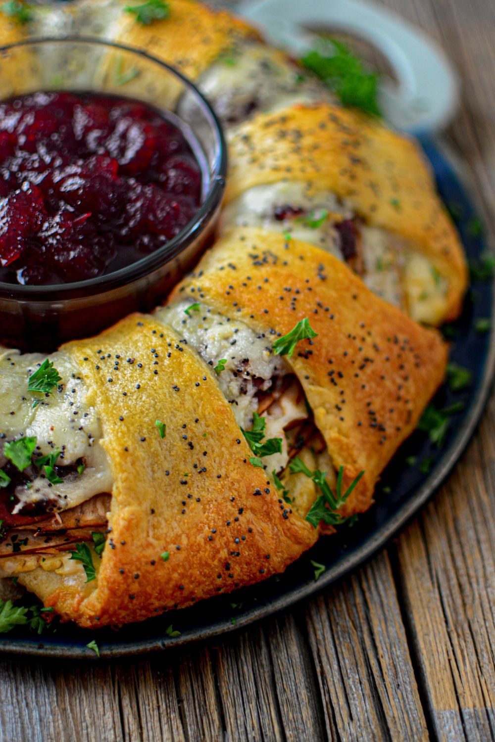 side view of crescent turkey ring on table with cranberry in the center