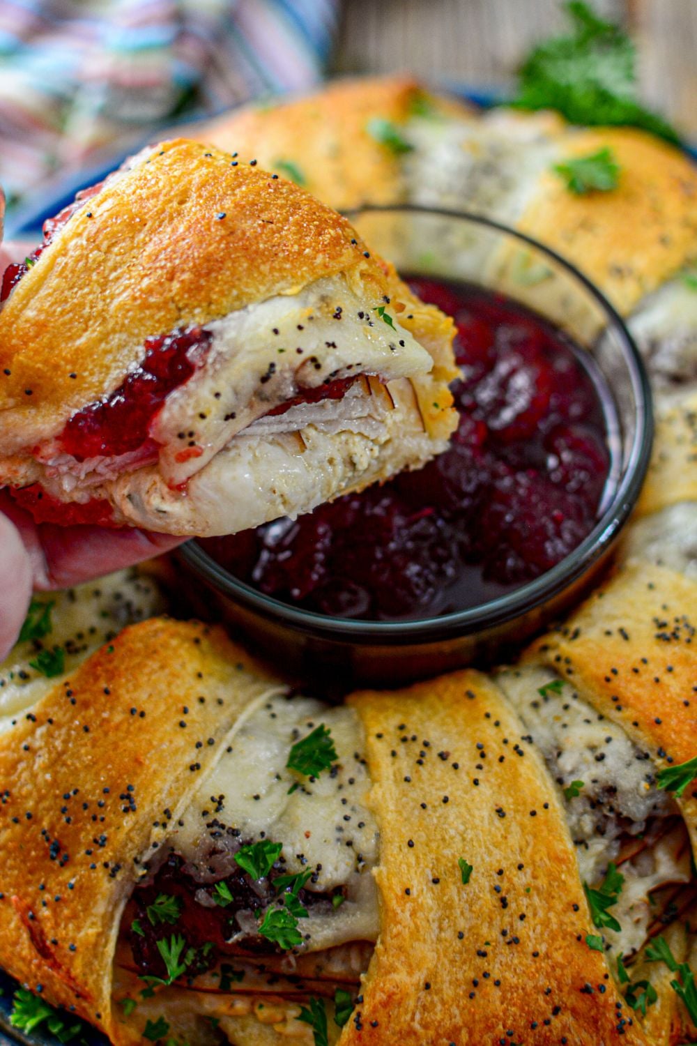 crescent turkey sliced and being held in hand