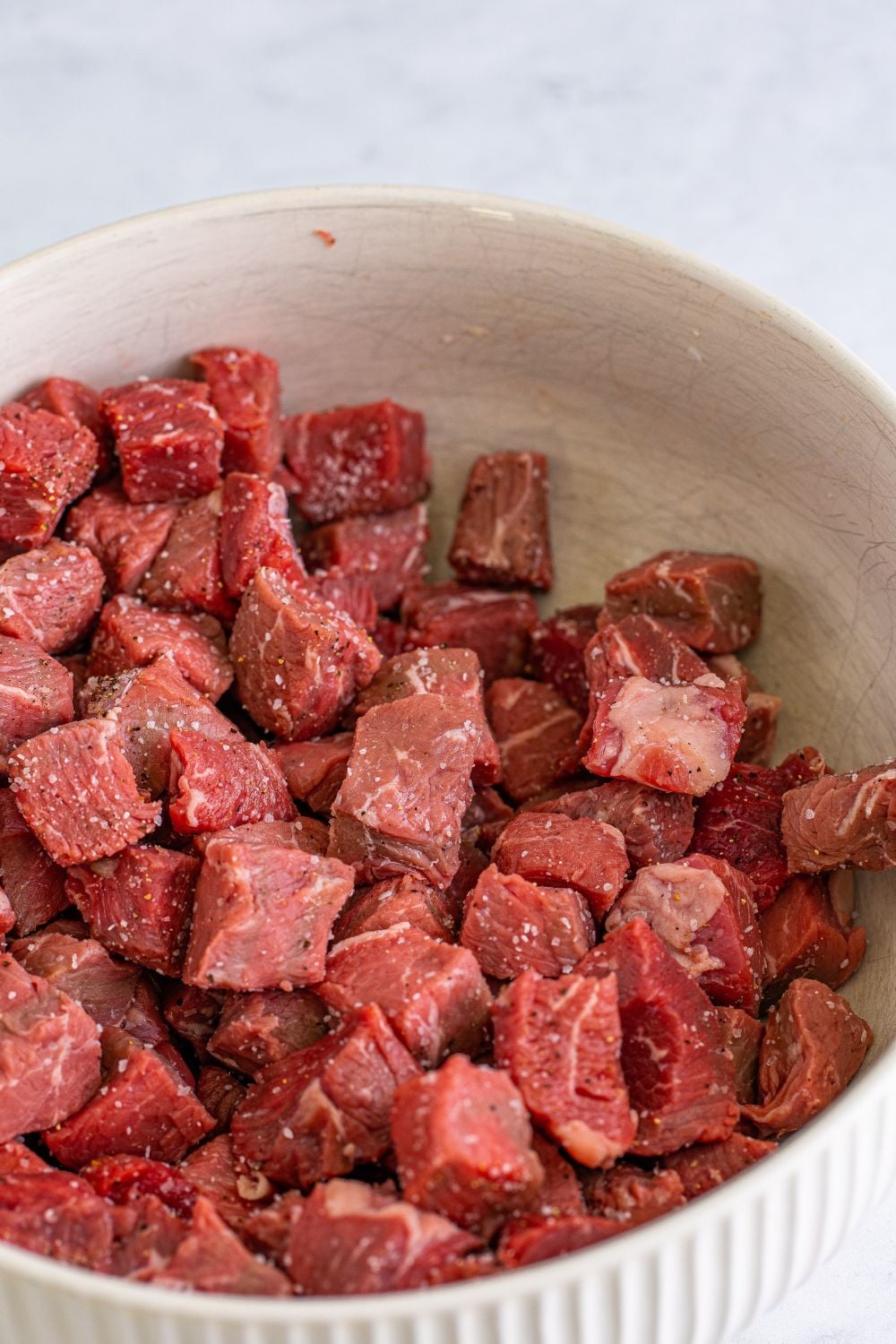 steak and seasonings in a bowl on table