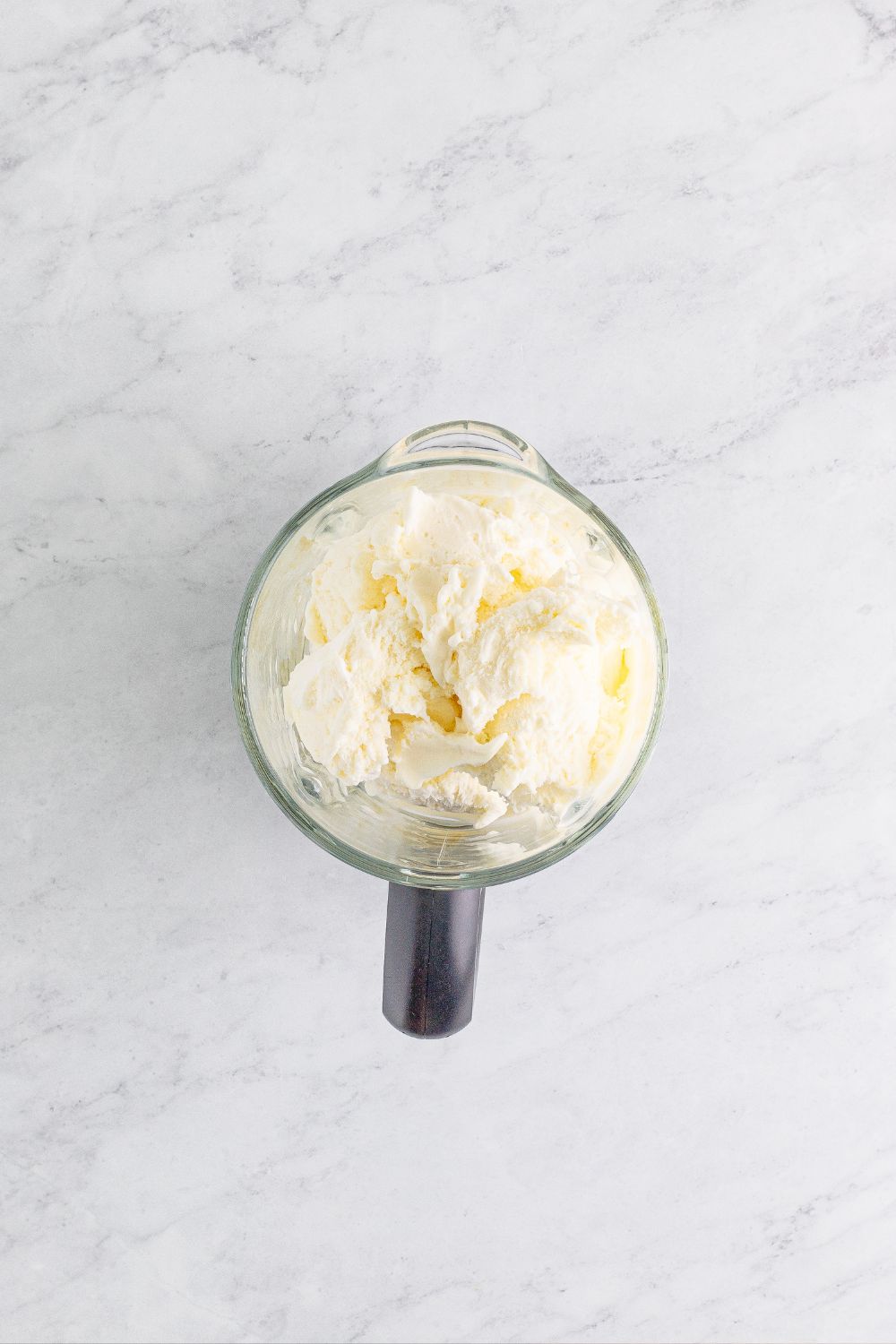 blender with ice cream sitting on table