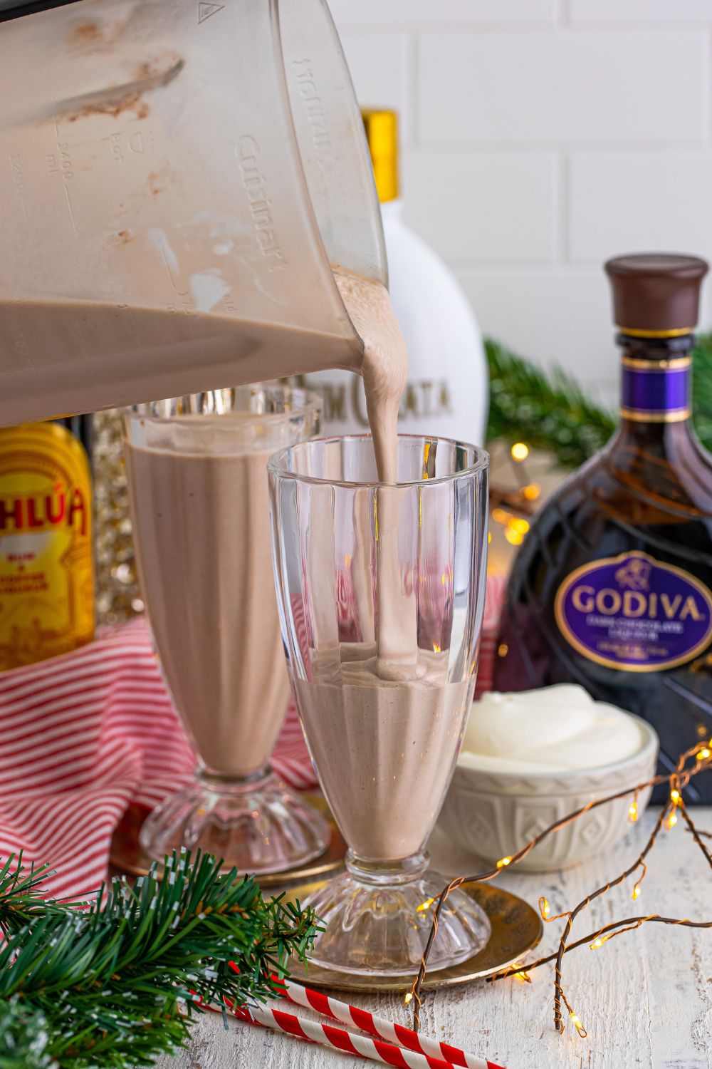 pouring milkshakes into glasses