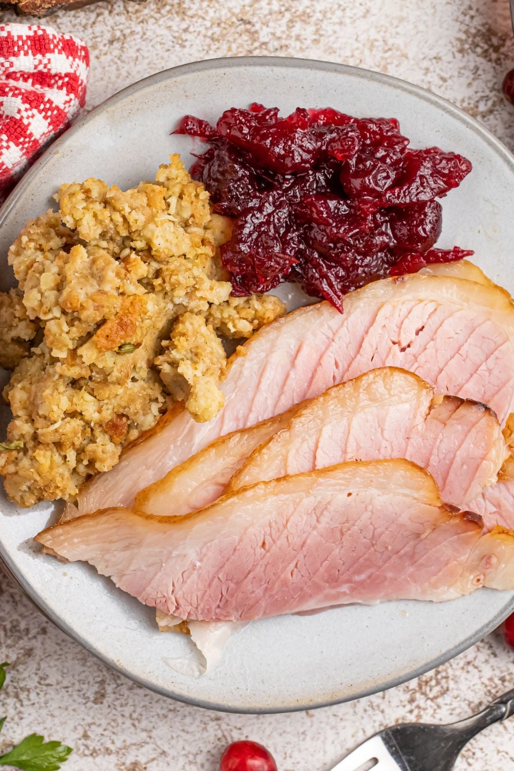 ham, stuffing and cranberry on plate