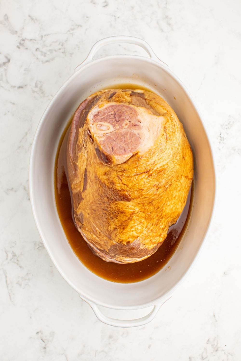 ham and coke mixture in a pan on table