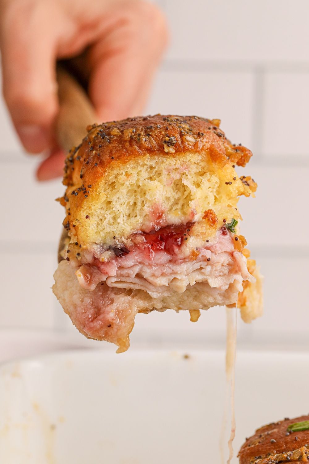 hawaiian slider on spatula above pan