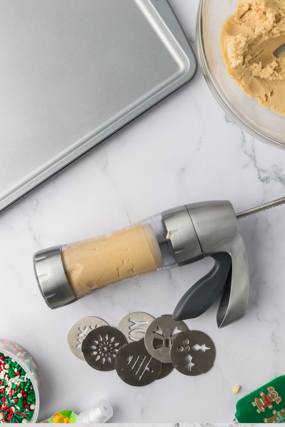 cookie press with cookie dough in it