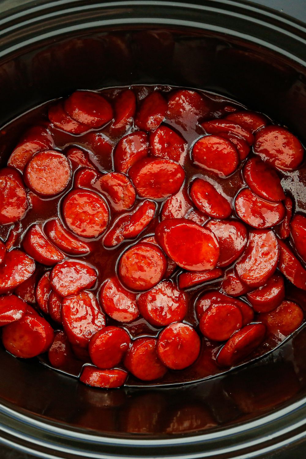kielbasa bites in a slow cooker on table