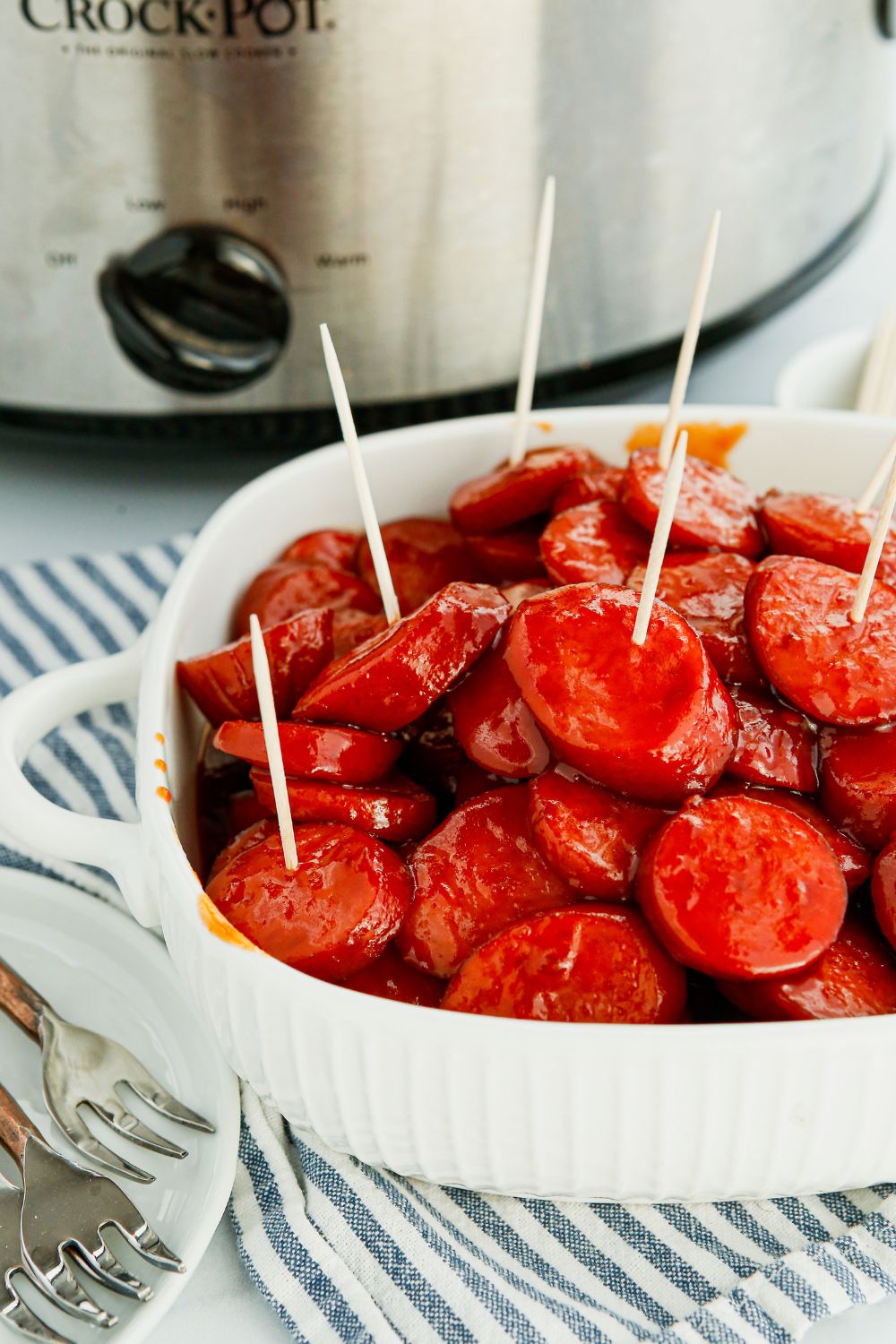 Crockpot Kielbasa Bites in a bowl with toothpicks