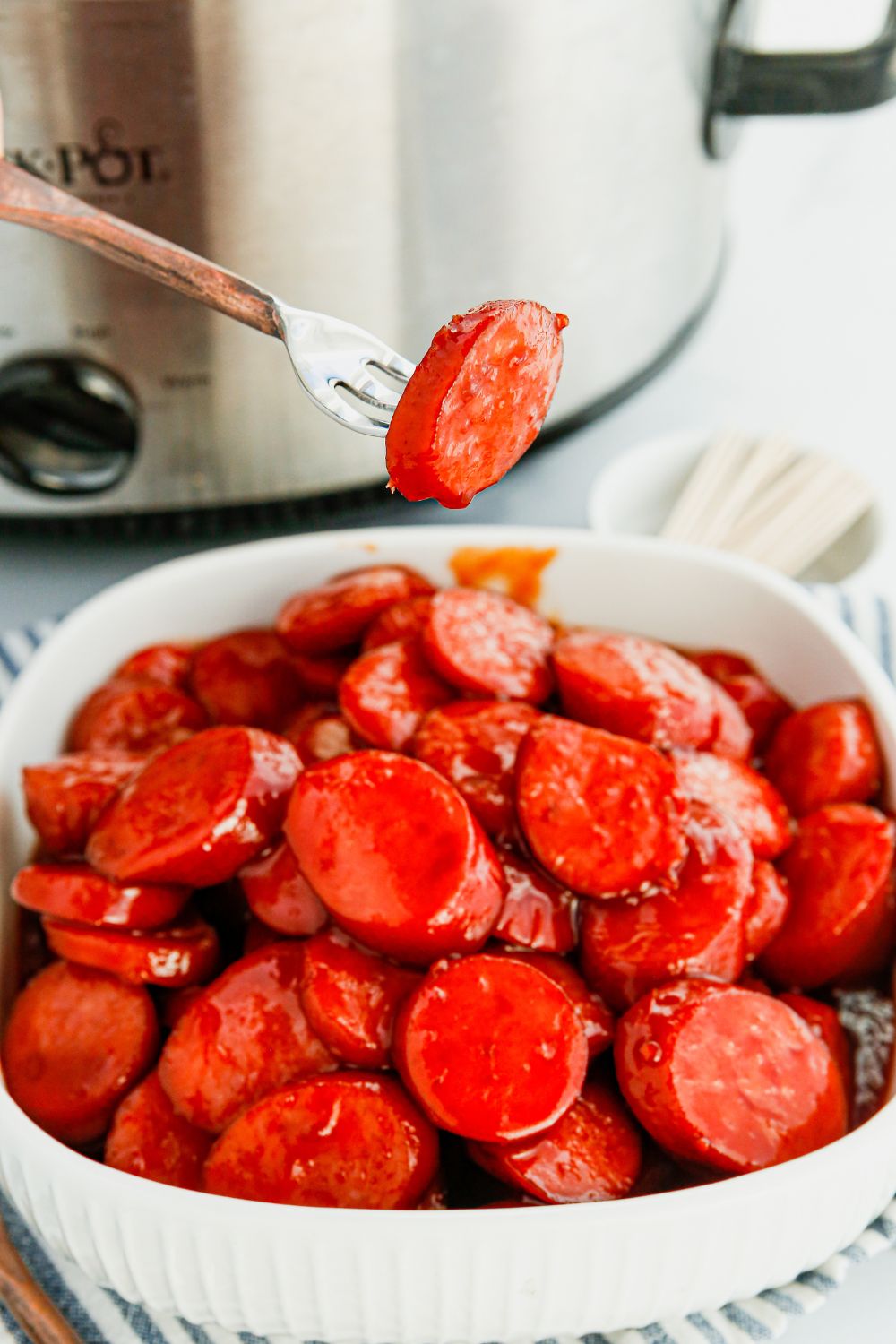 fork with a kielbasa bite on the fork