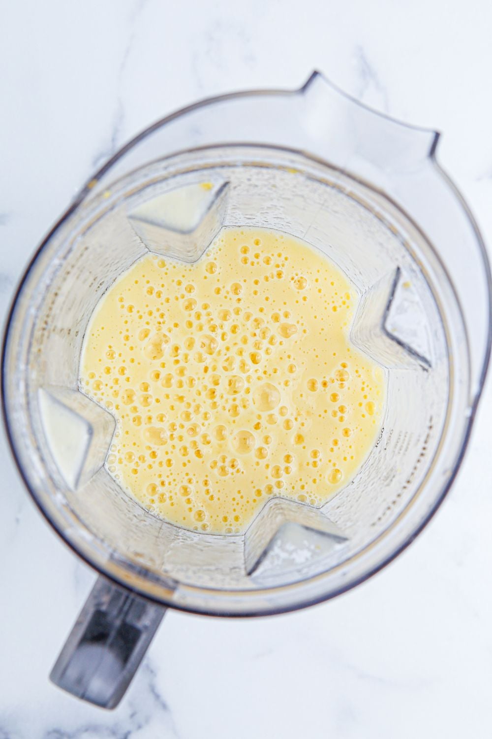 food processor with ingredients blended 