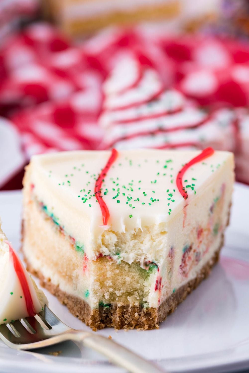little debbie christmas tree cake cheesecake slice on plate with bite taken out
