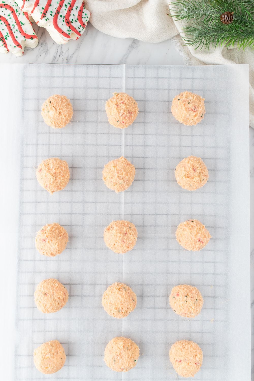 Christmas cake truffles on a lined cooling rack