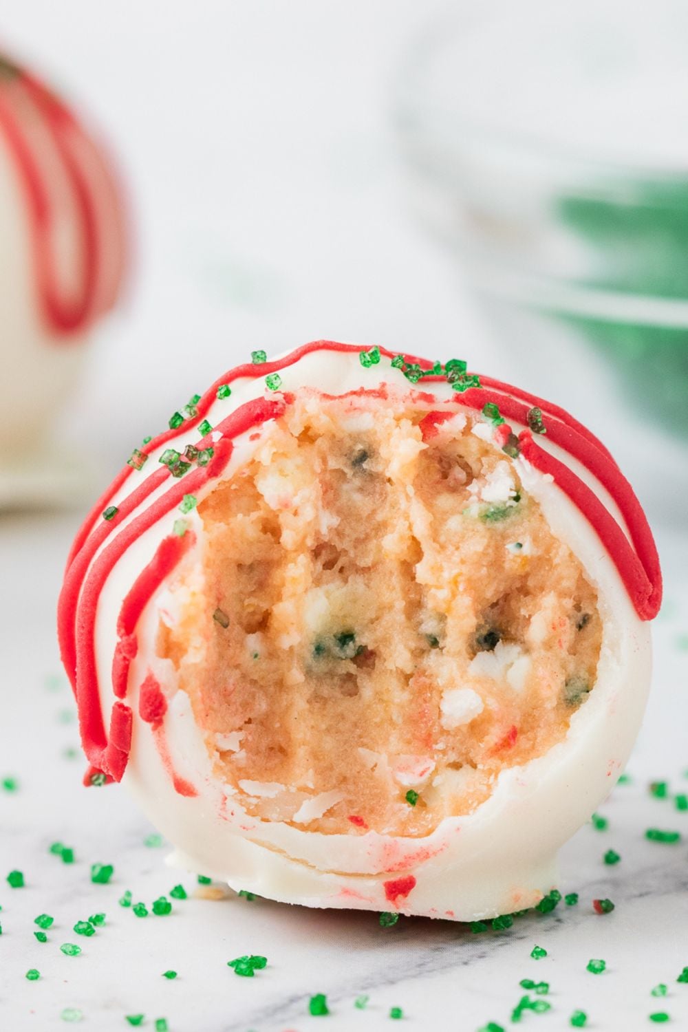 little debbie xmas tree cake bite with a bite taken out of it