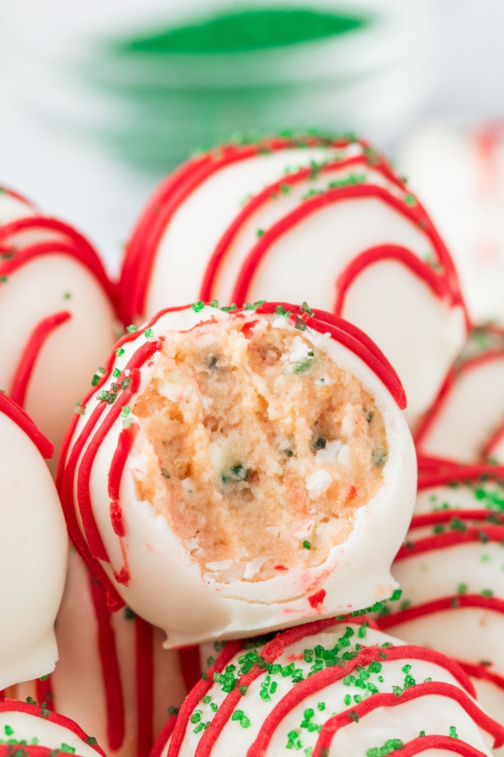 Little Debbie Christmas Tree Cake Truffles in bowl with bite taken out of it