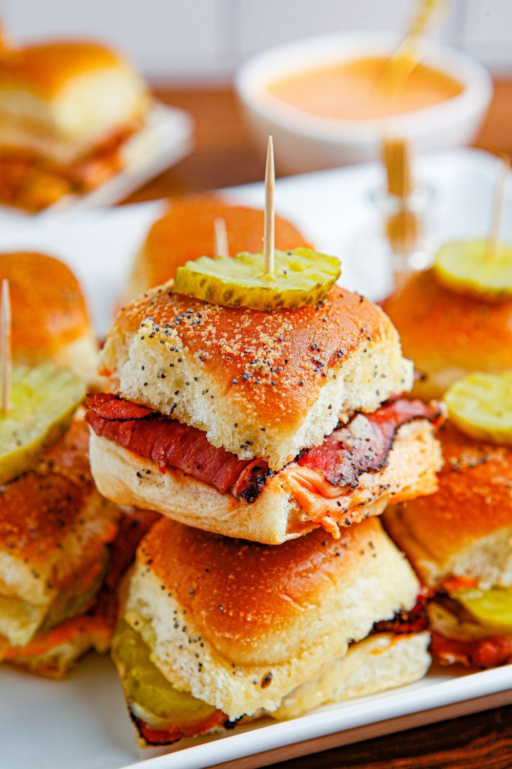 stacked sliders on buns on table