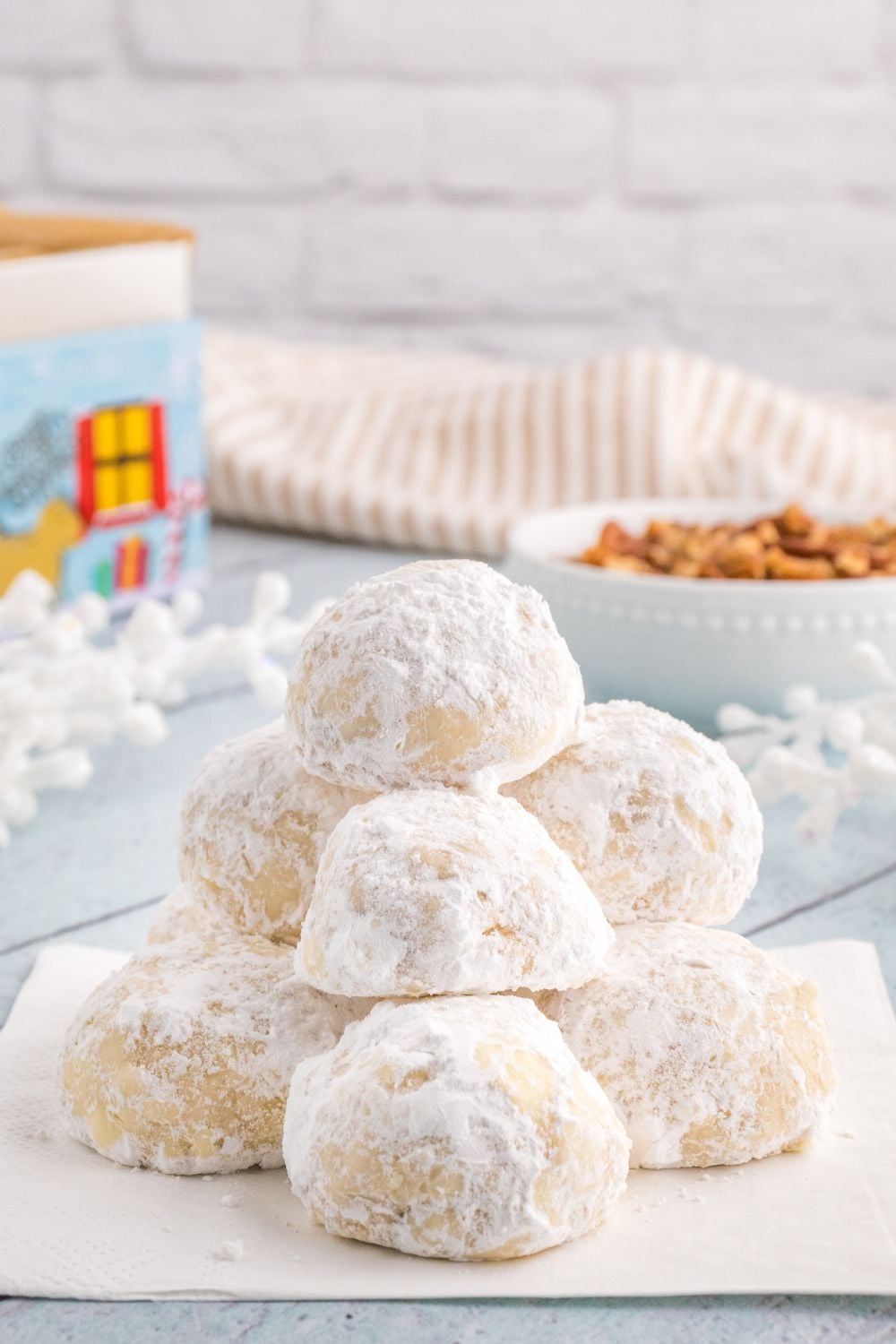 powder cookies stacked on a cookie tray
