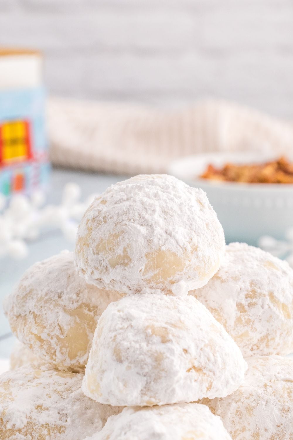 powdered cookies stacked on a tray
