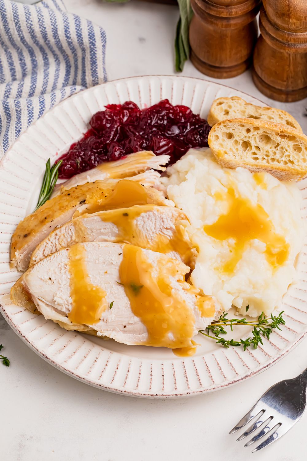 roasted turkey on table with food around it