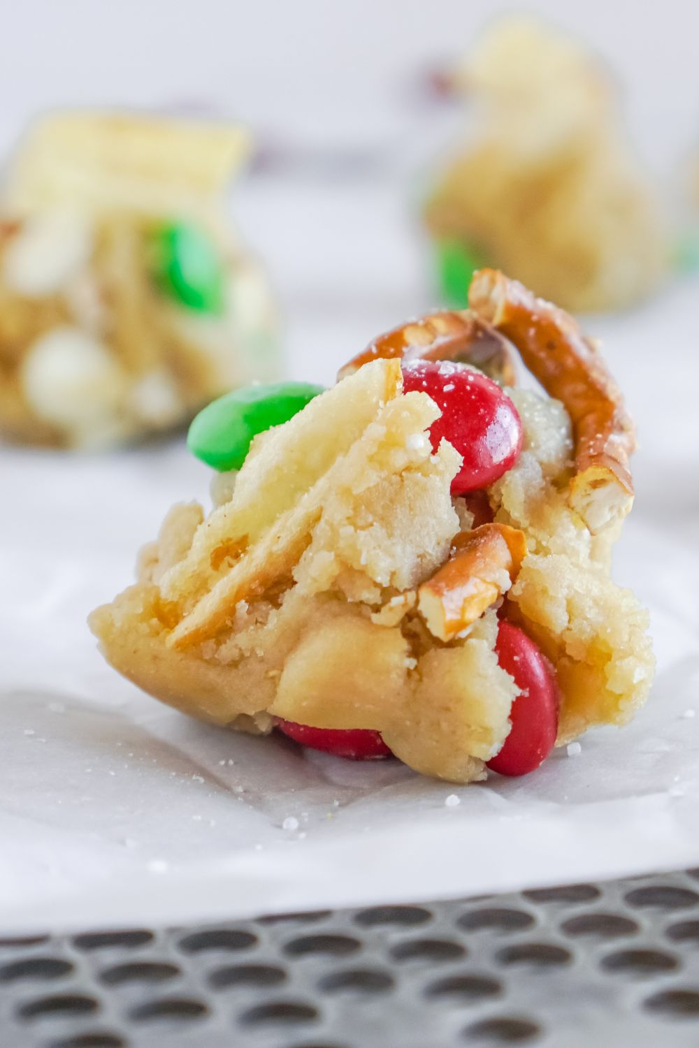 a scoop of cookie dough on baking sheet close up view