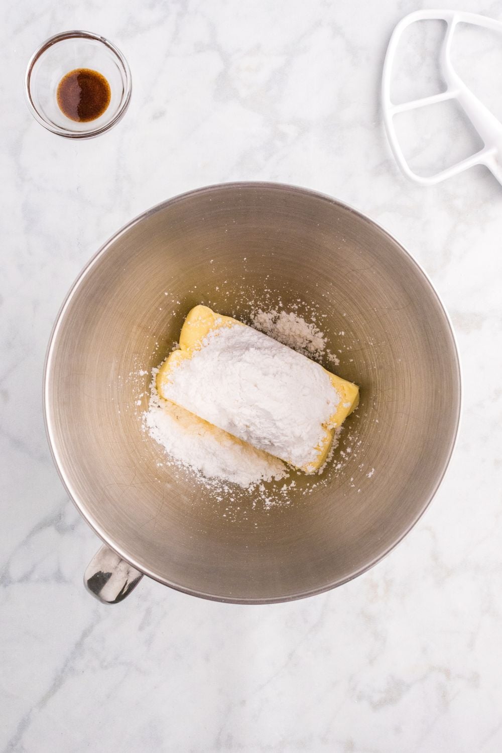 butter and powdered sugar in a mixing bowl
