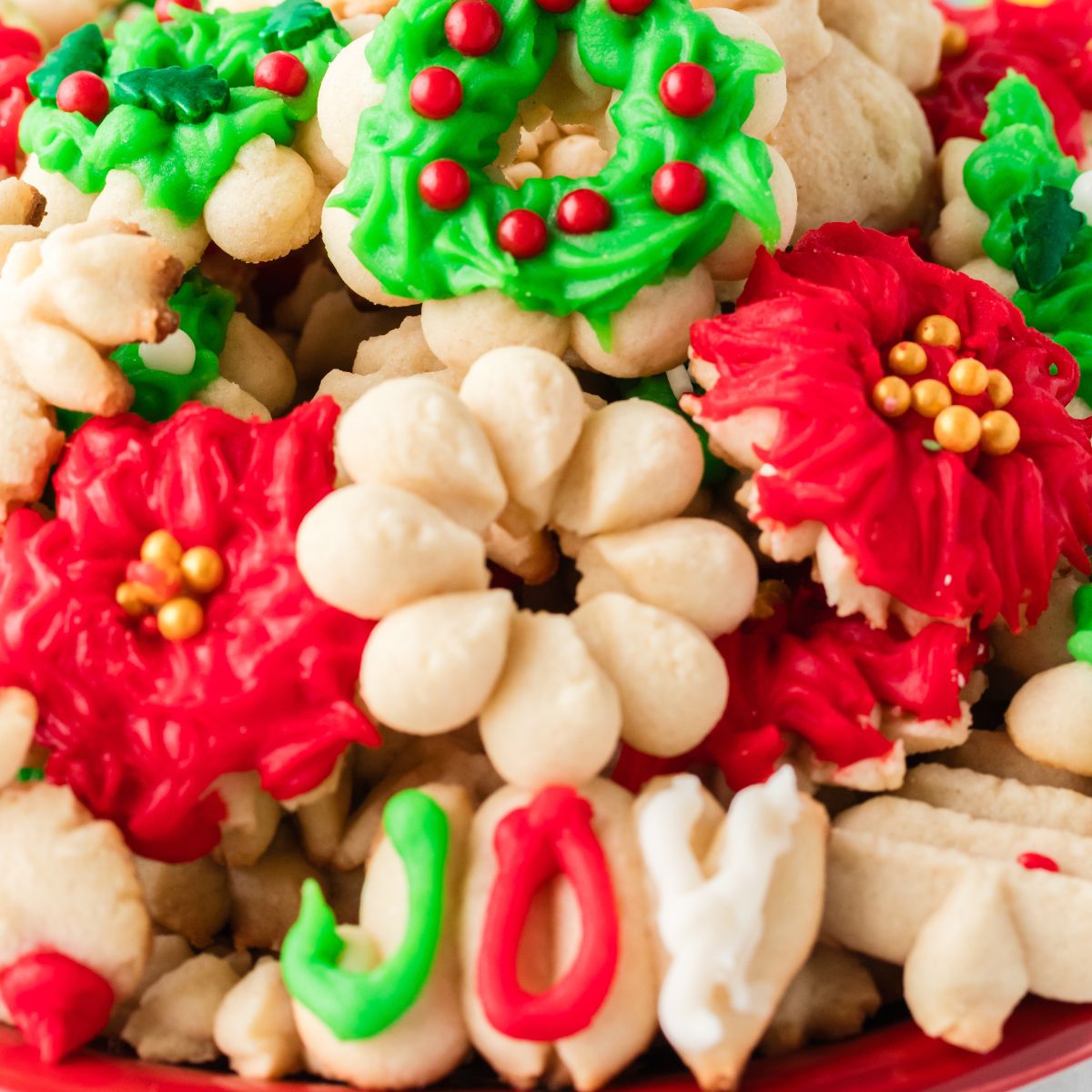 Christmas Spritz Cookies stacked on platter