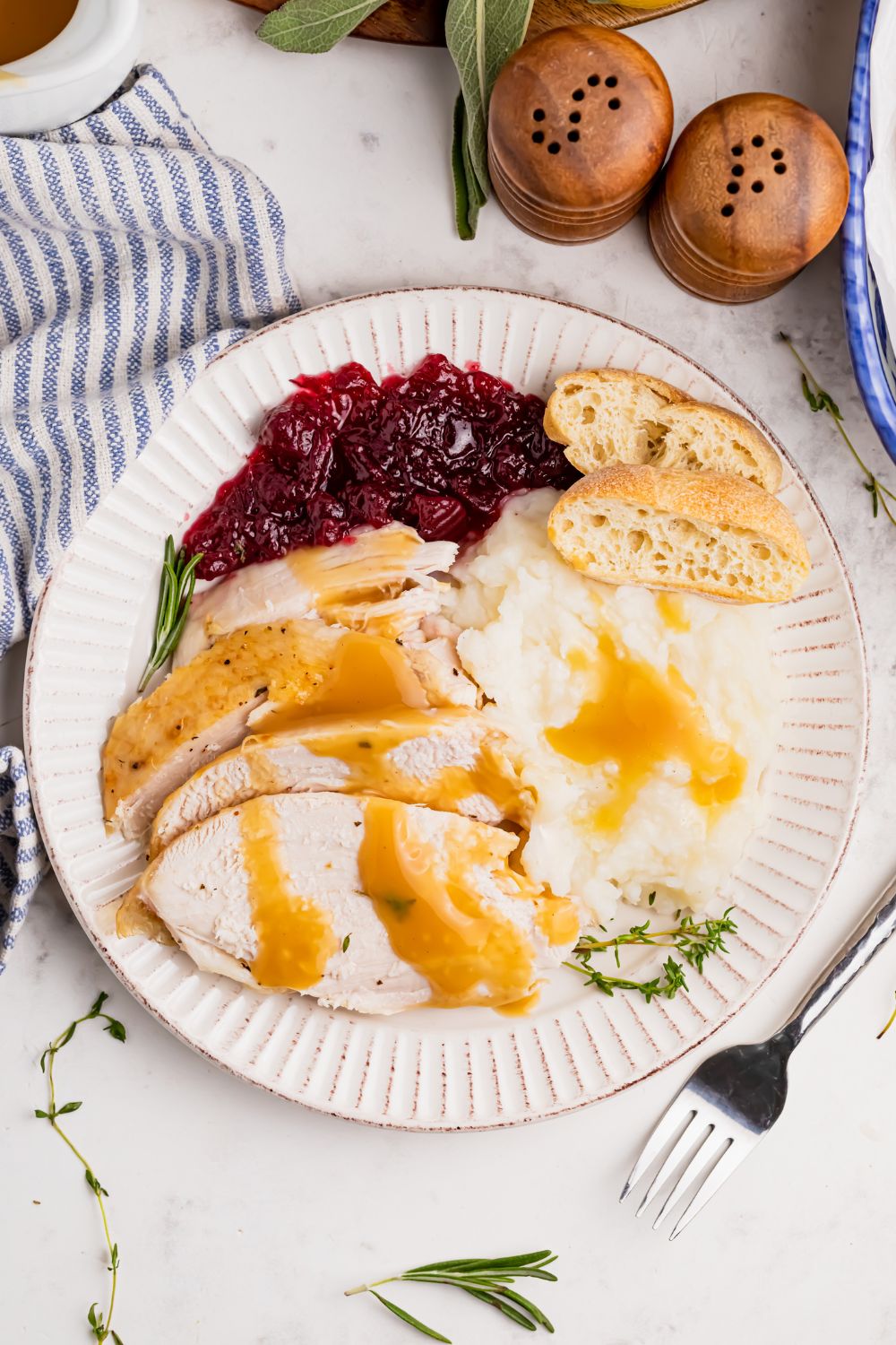 overhead plate with turkey and mashed potatoes and more on table
