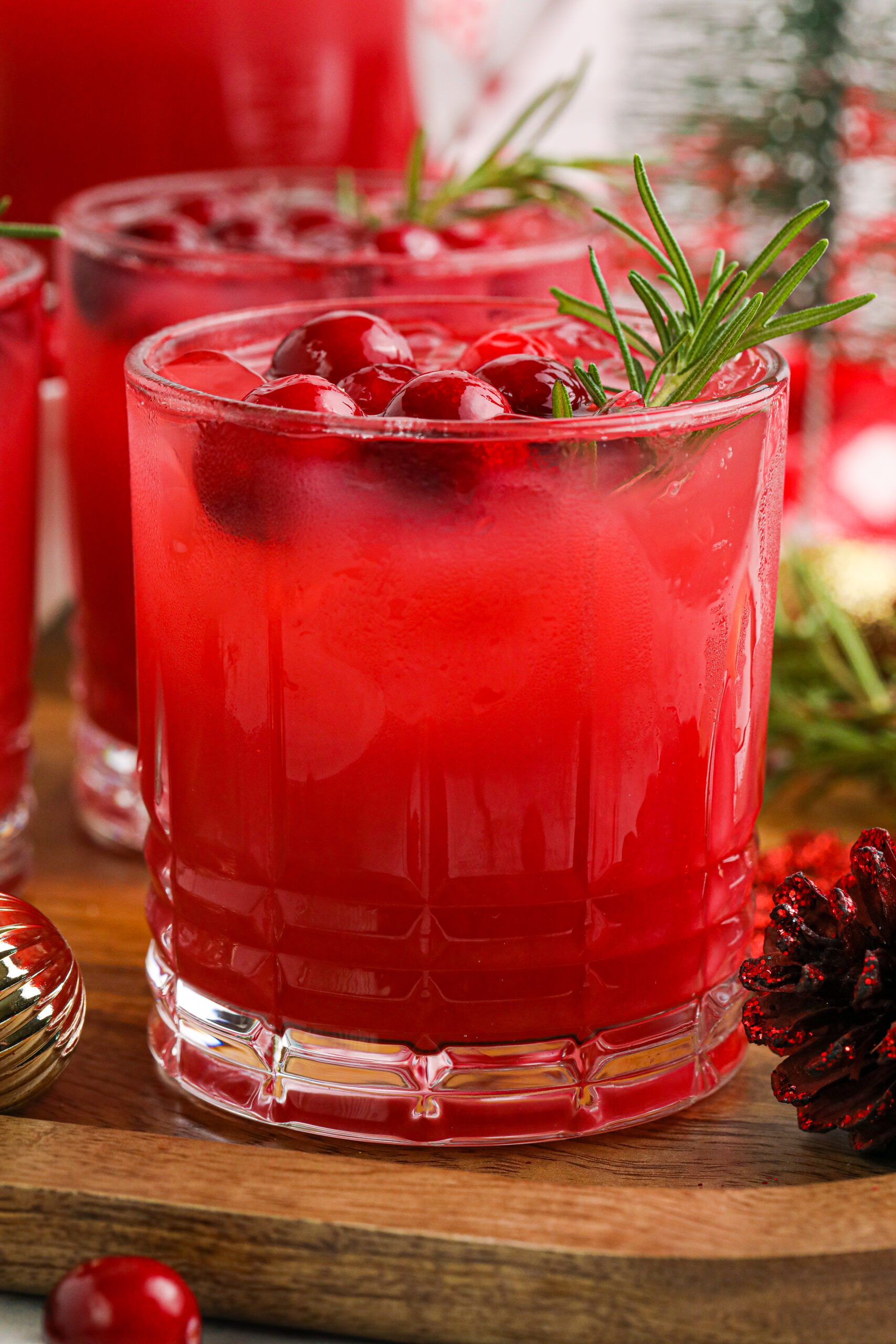 close up of punch in a glass garnished with berries