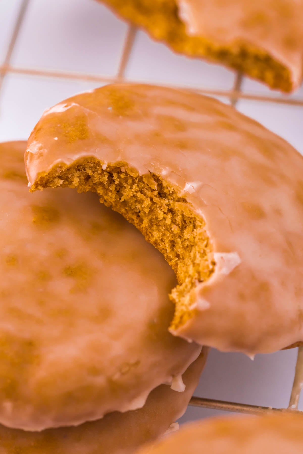 gingerbread cookie on table with a bite taken out of it