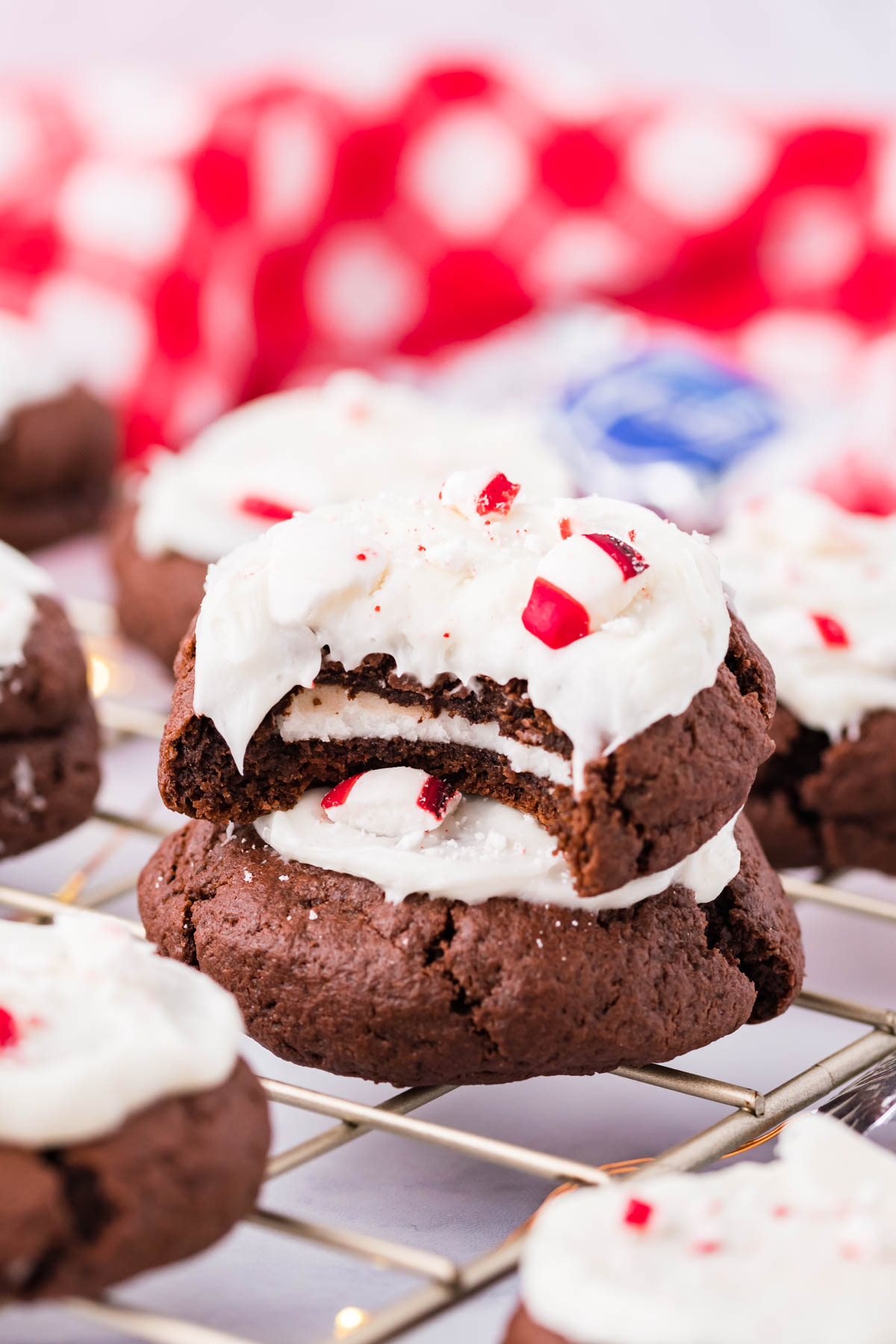 Peppermint Patty Stuffed Cookies on a cooling rack with a bite missing