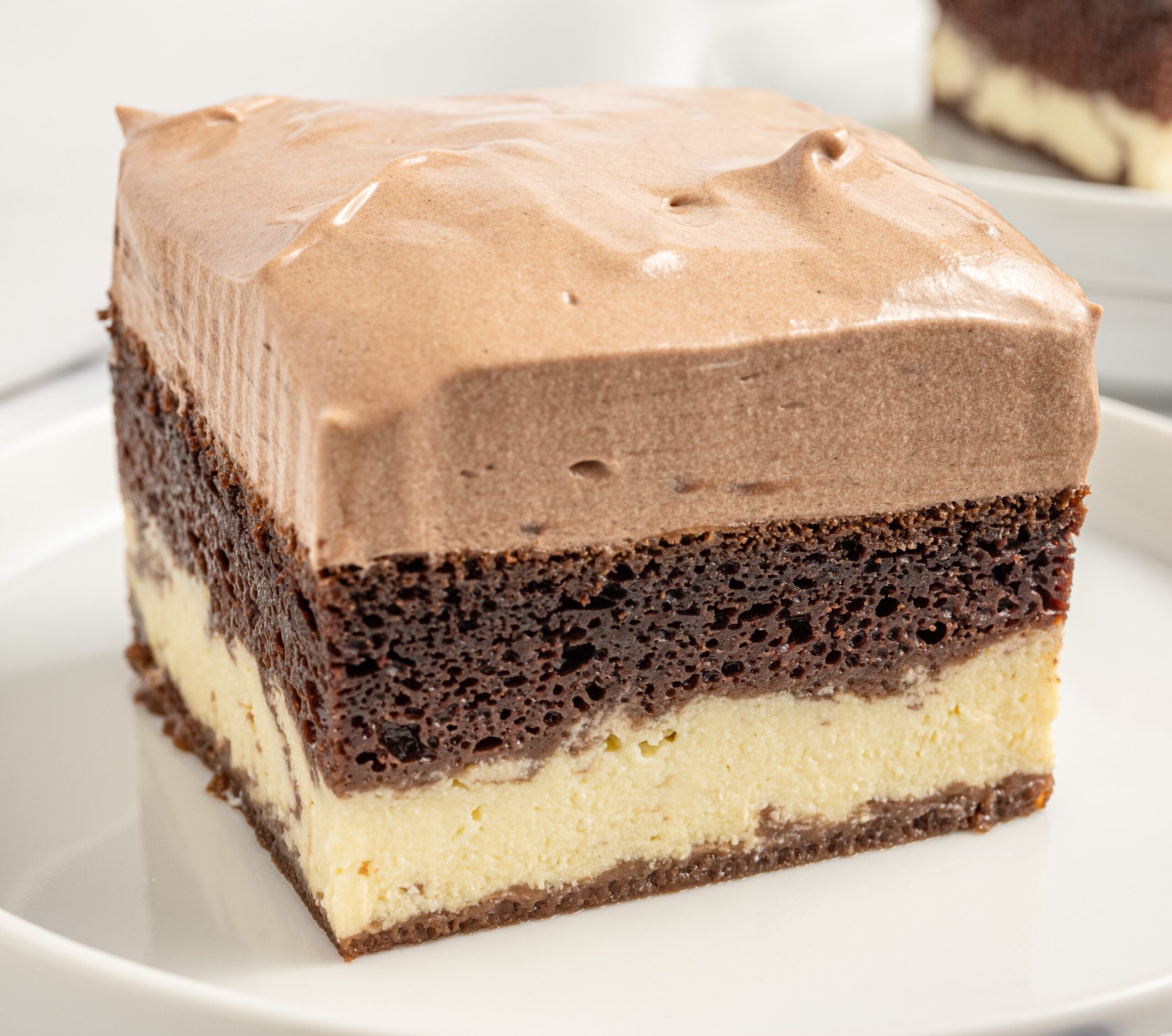 up close photo of the Italian Love Cake sliced cake on a white plate 