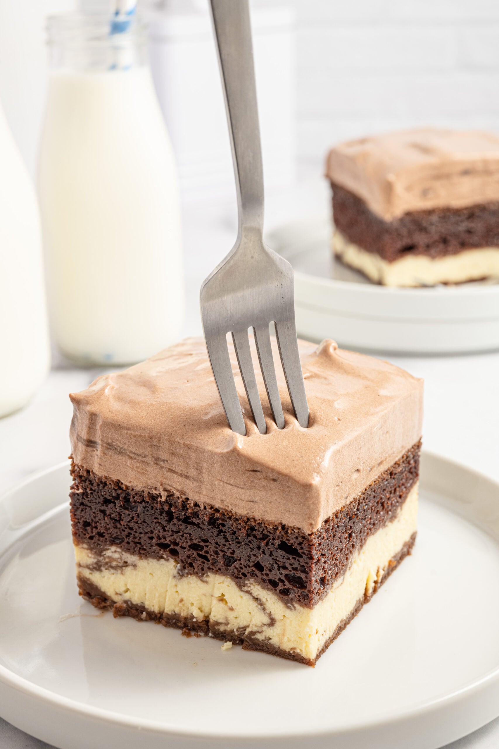Italian Love Cake sliced cake on plate with fork going into it