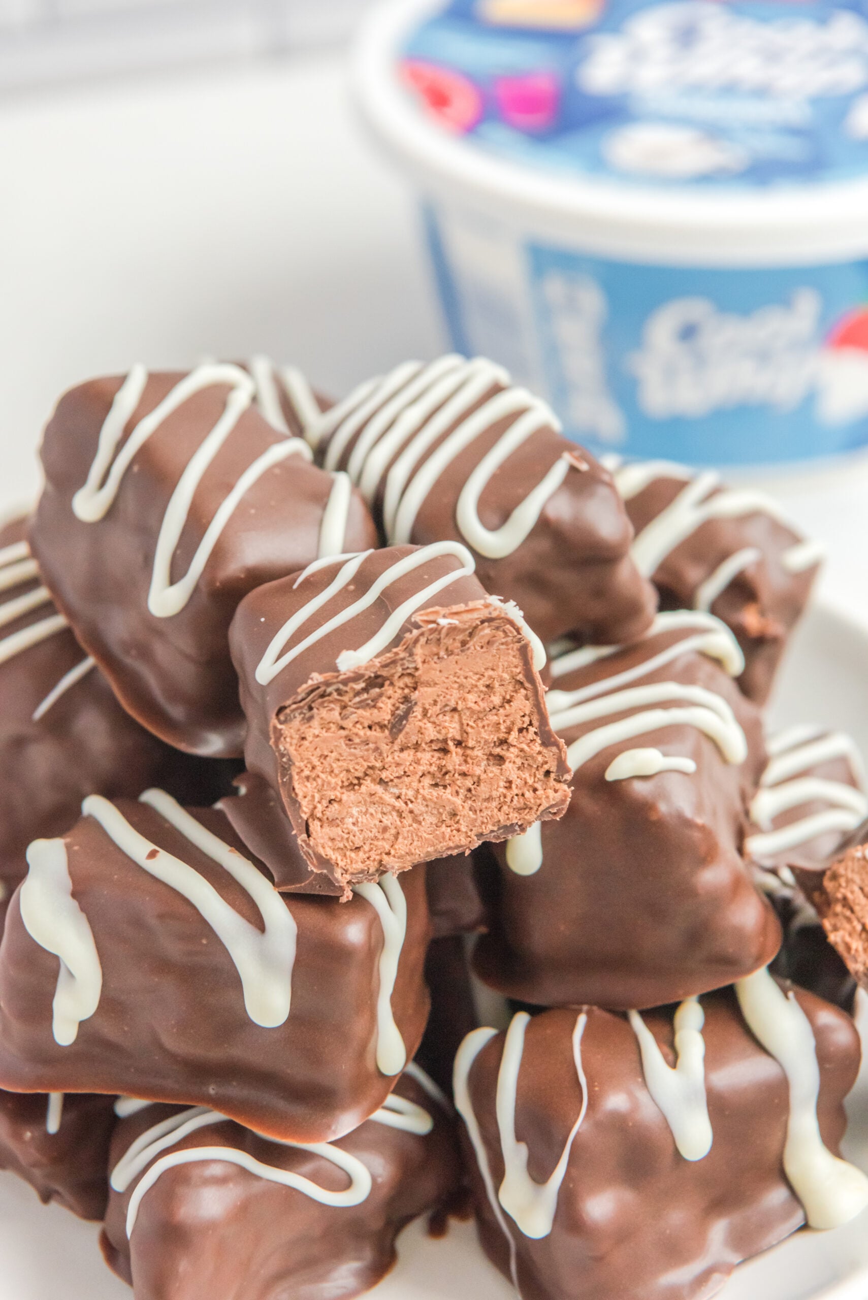 a big stack of Cool Whip Candy with a bite taken out of the top one