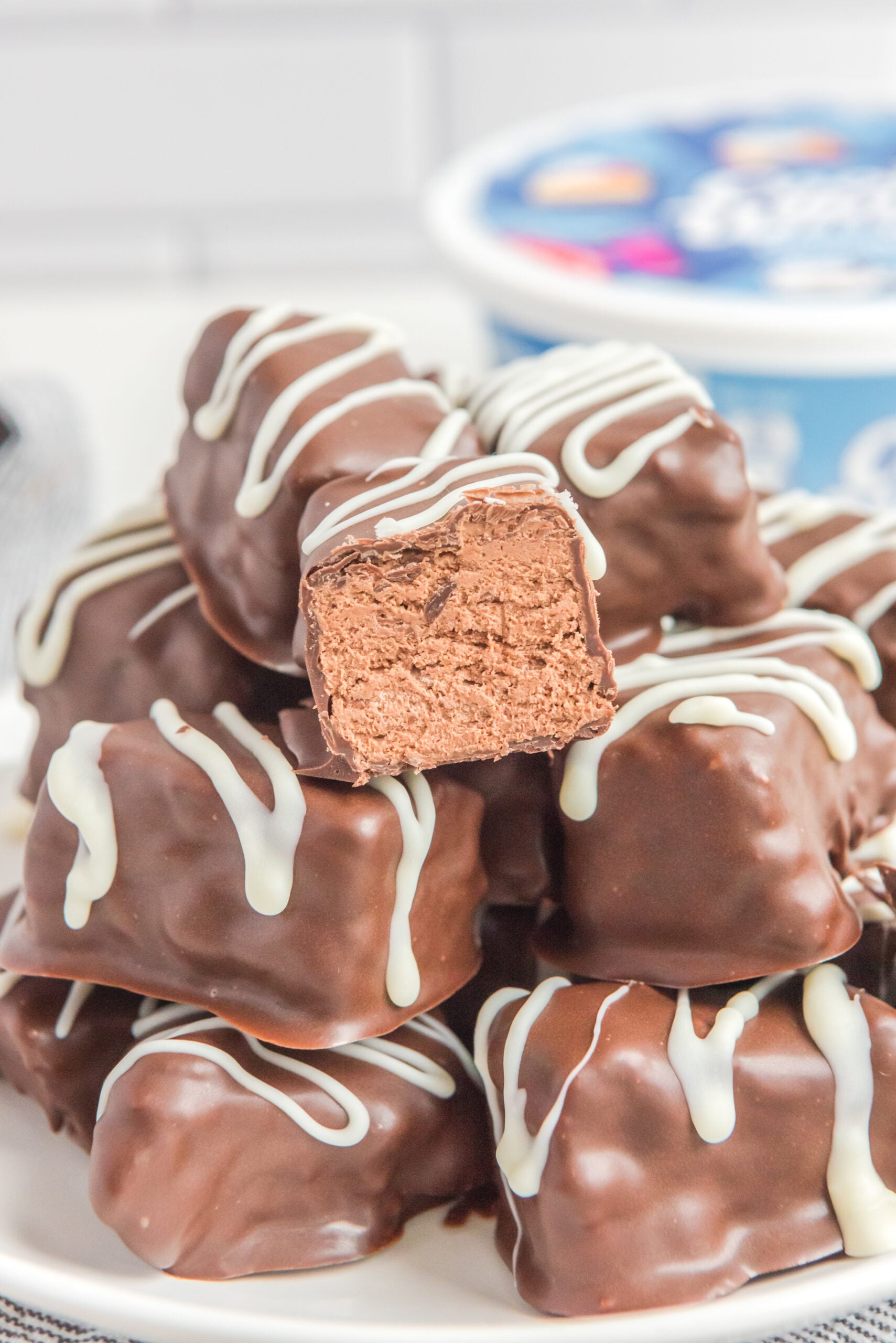 a big stack of Cool Whip Candy with a bite taken out of the top one