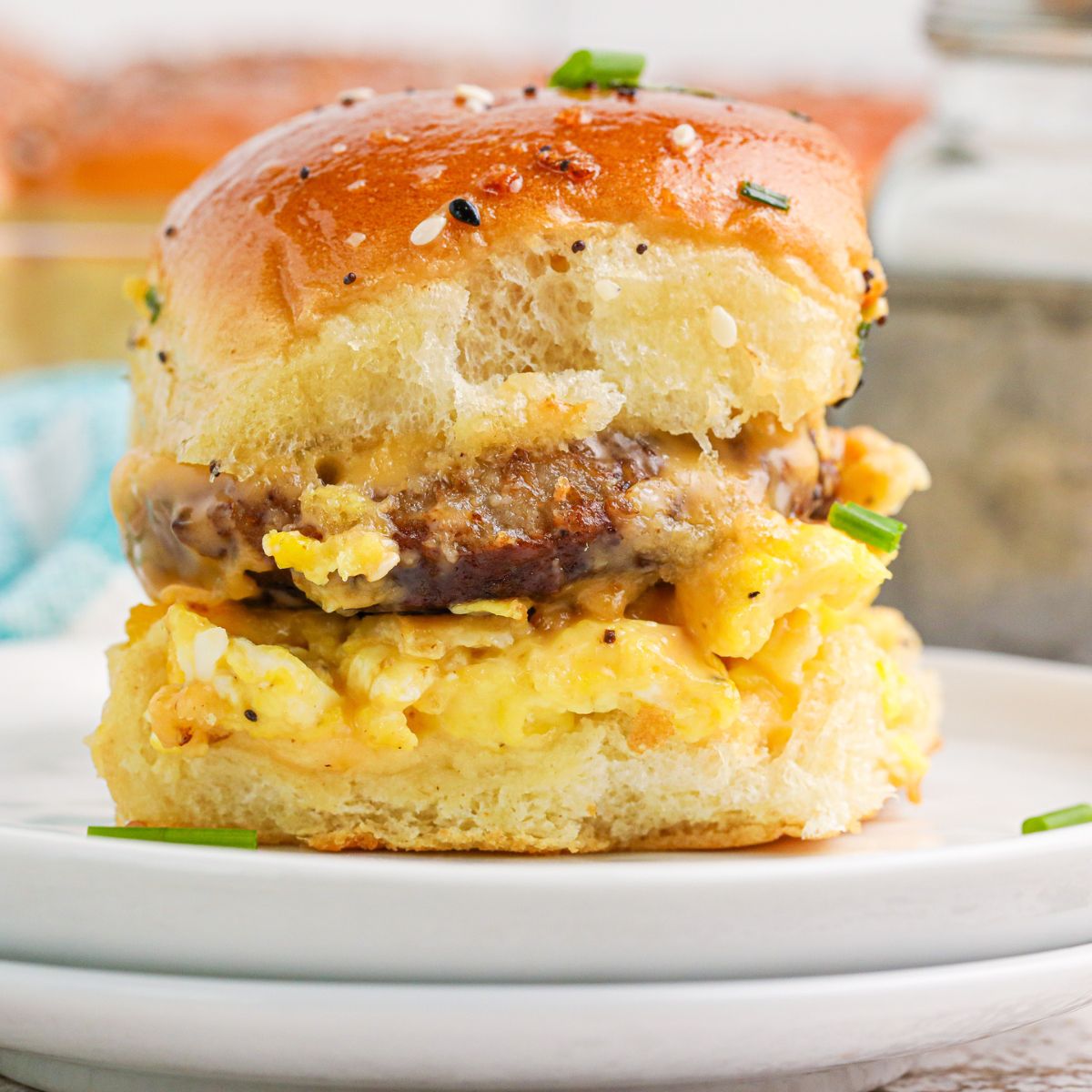 Breakfast Sliders with Sausage on a plate to see what the sandwich is full of 