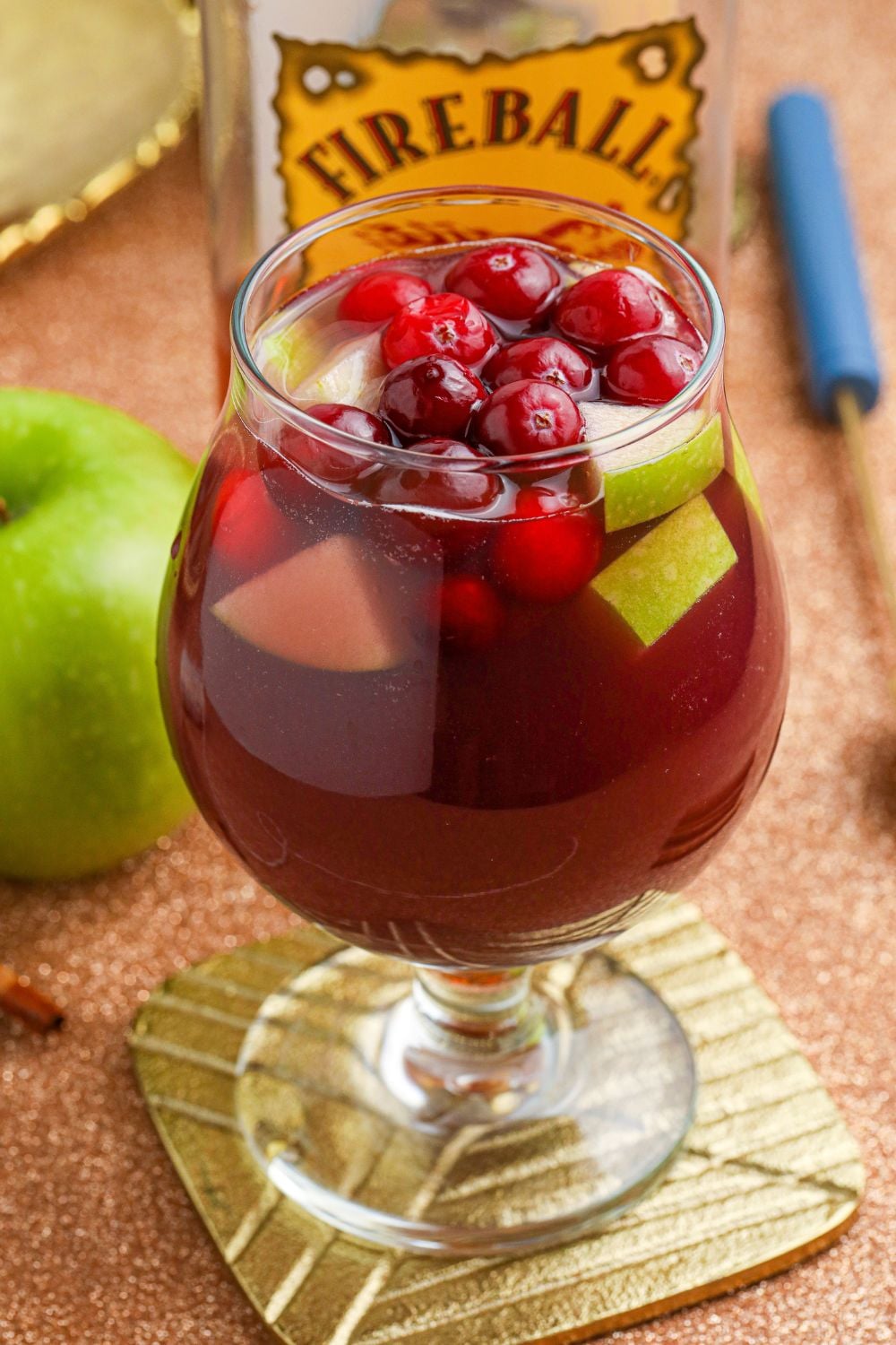 Fireball Sangria in glass sitting on coaster